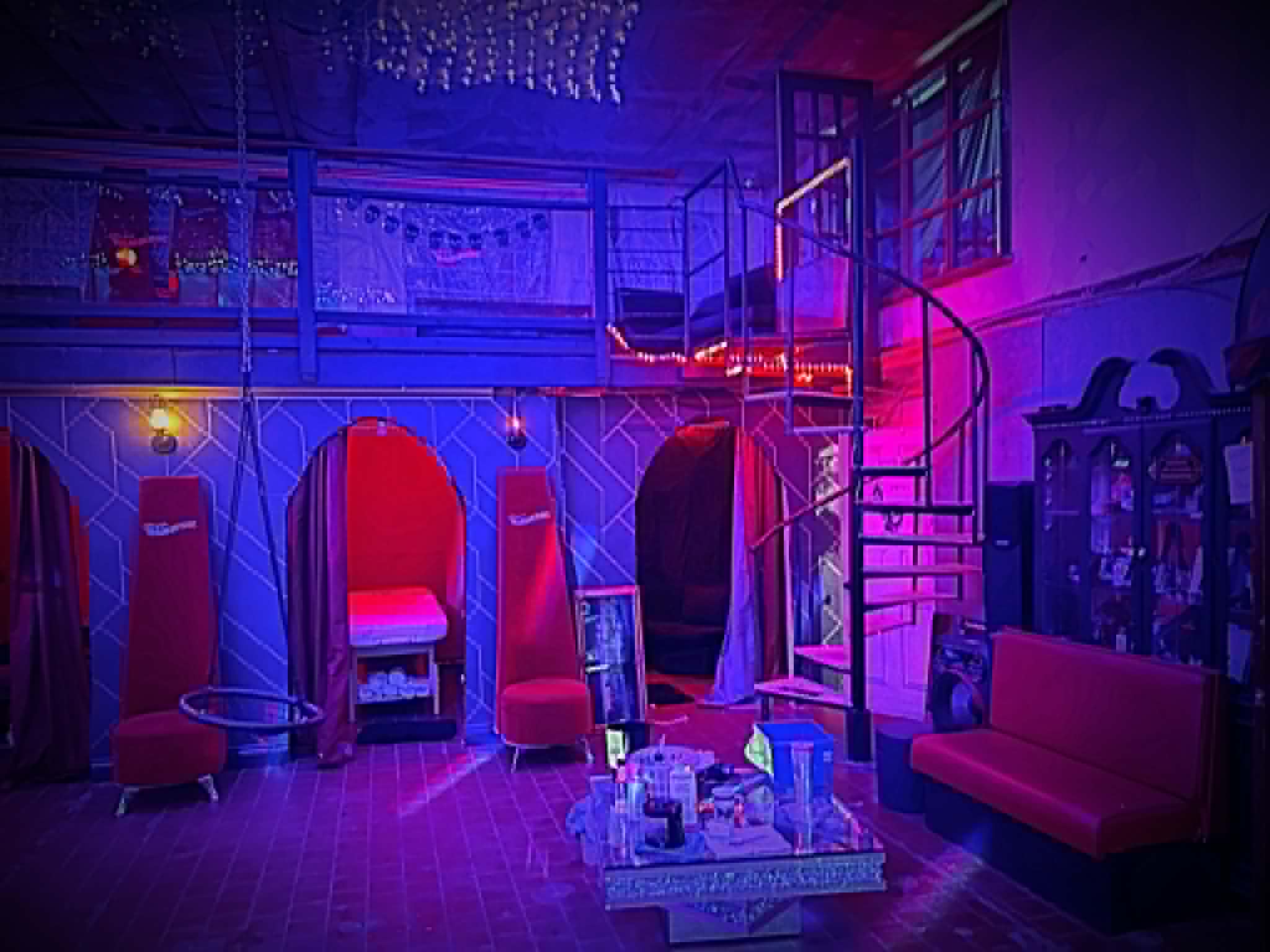 Massage tables and lounge area inside The Warehouse